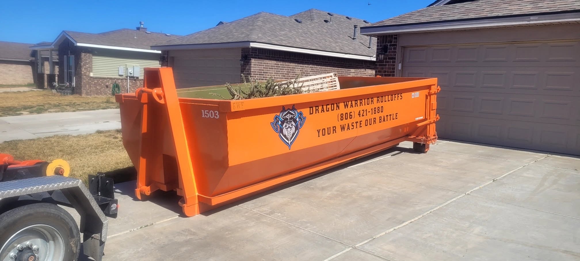 Roll off dumpster set on a residential driveway in Amarillo TX