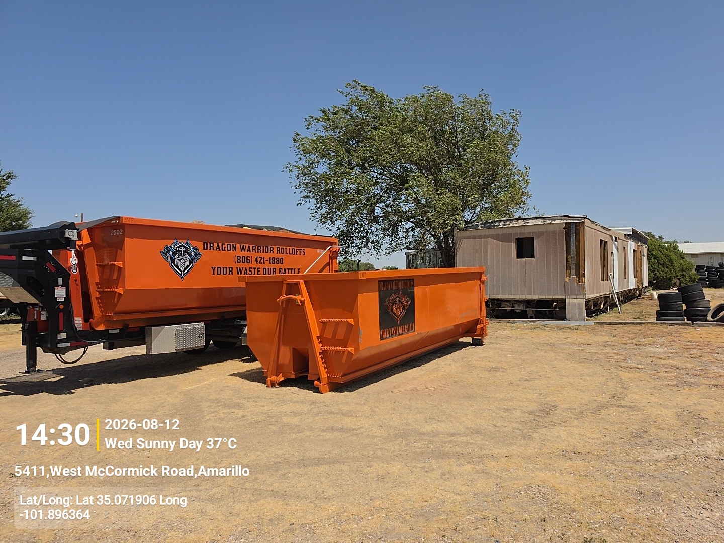 Two branded Dragon Warrior Rolloffs 25 yard dumpsters at the Amarillo yard