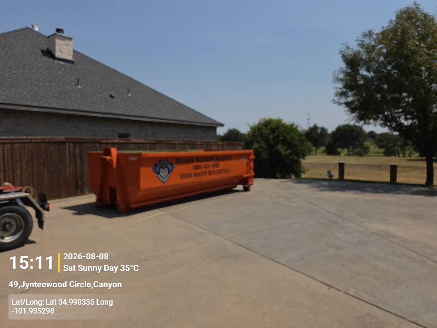 Roll off dumpster set clear of the house for a cleanout in Memphis TX