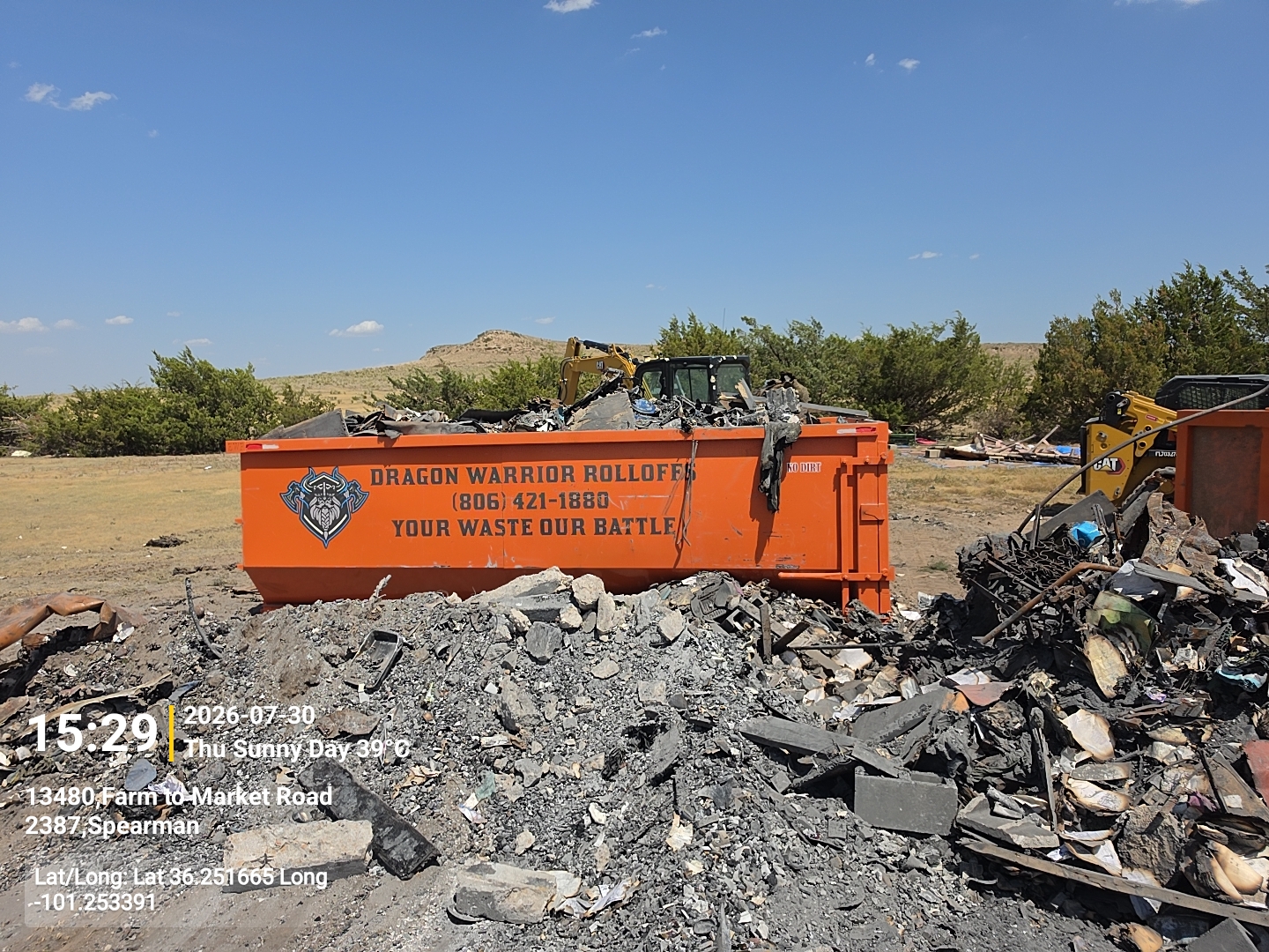 Roll off dumpster loaded with heavy debris in Deaf Smith County TX