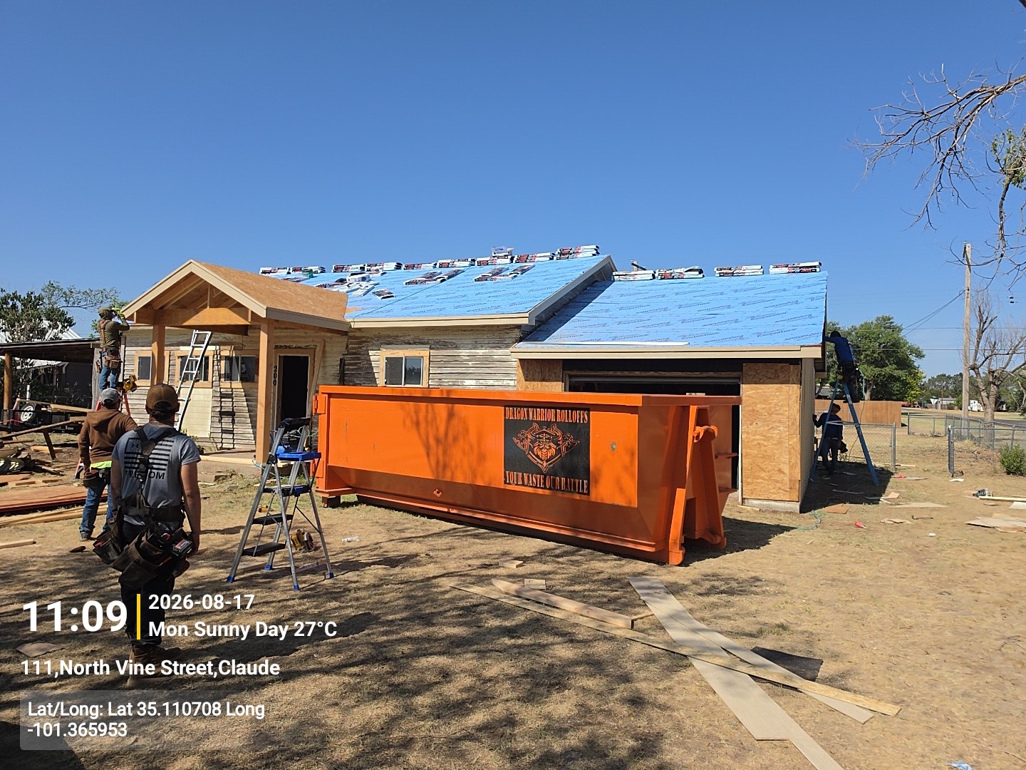 Roll off dumpster taking tear off from a roof job in Hereford TX